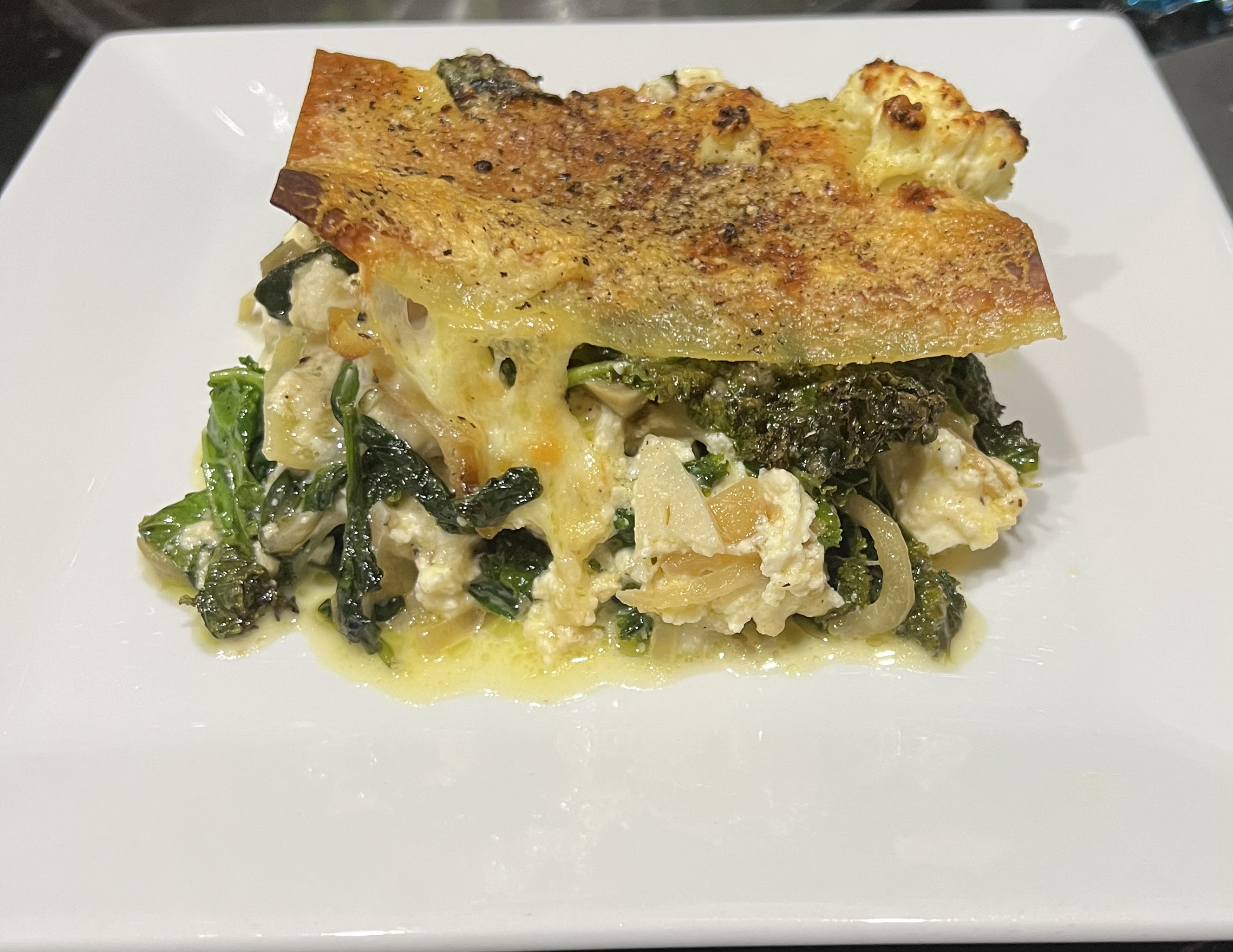 Baked pasta with artichokes, greens, and too much cheese