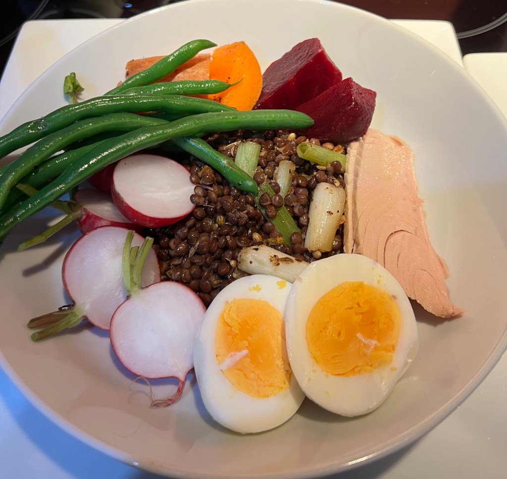 Spiced black lentil salad with oil-packed tuna, radishes, and purple&nbsp;potatoes