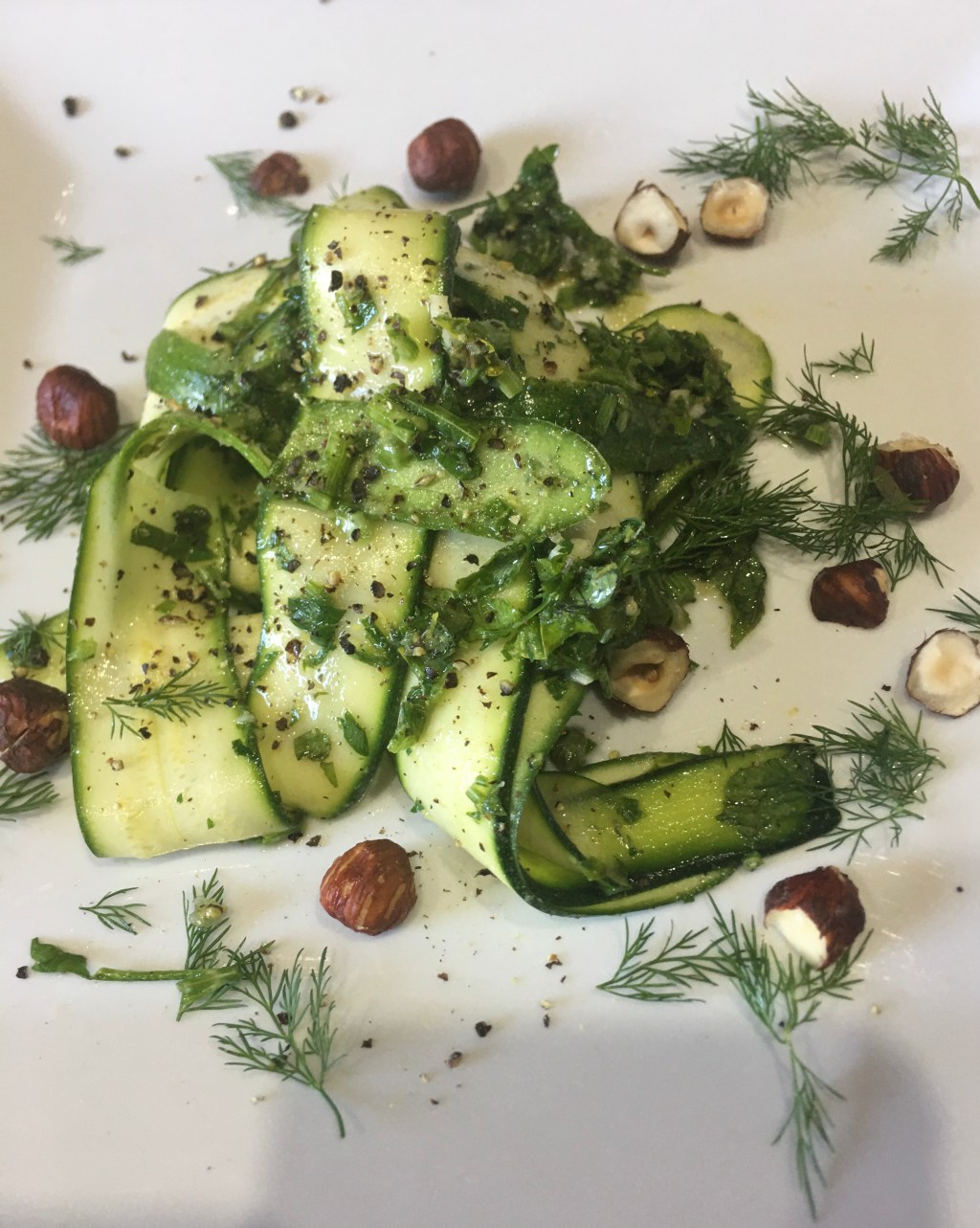 *Raw zucchini, hazelnuts, lemon and&nbsp;herbs