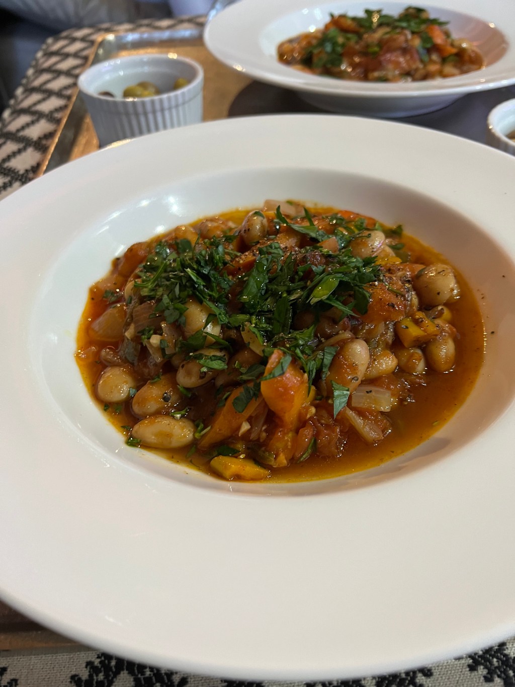 *Baked lima bean soup and pickles&nbsp;(Fassolada)