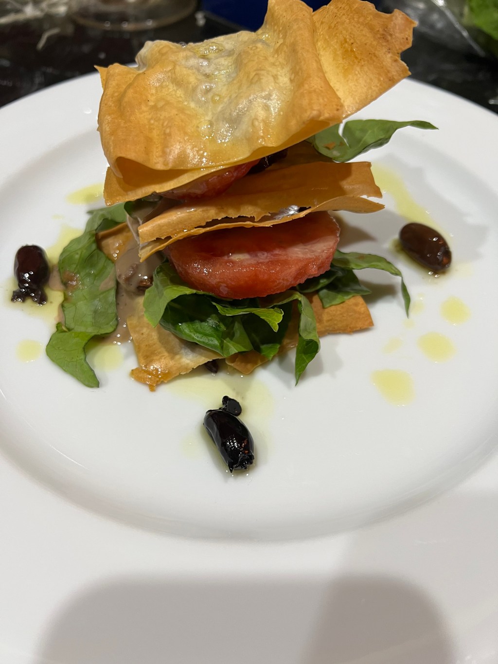 Olives, garlic and tomato in handmade filo pastry with anchovy&nbsp;sauce