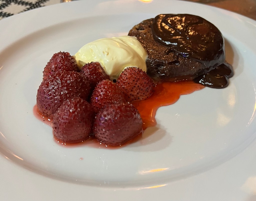 Double-baked chocolate souffles with baked strawberries and chocolate&nbsp;sauce