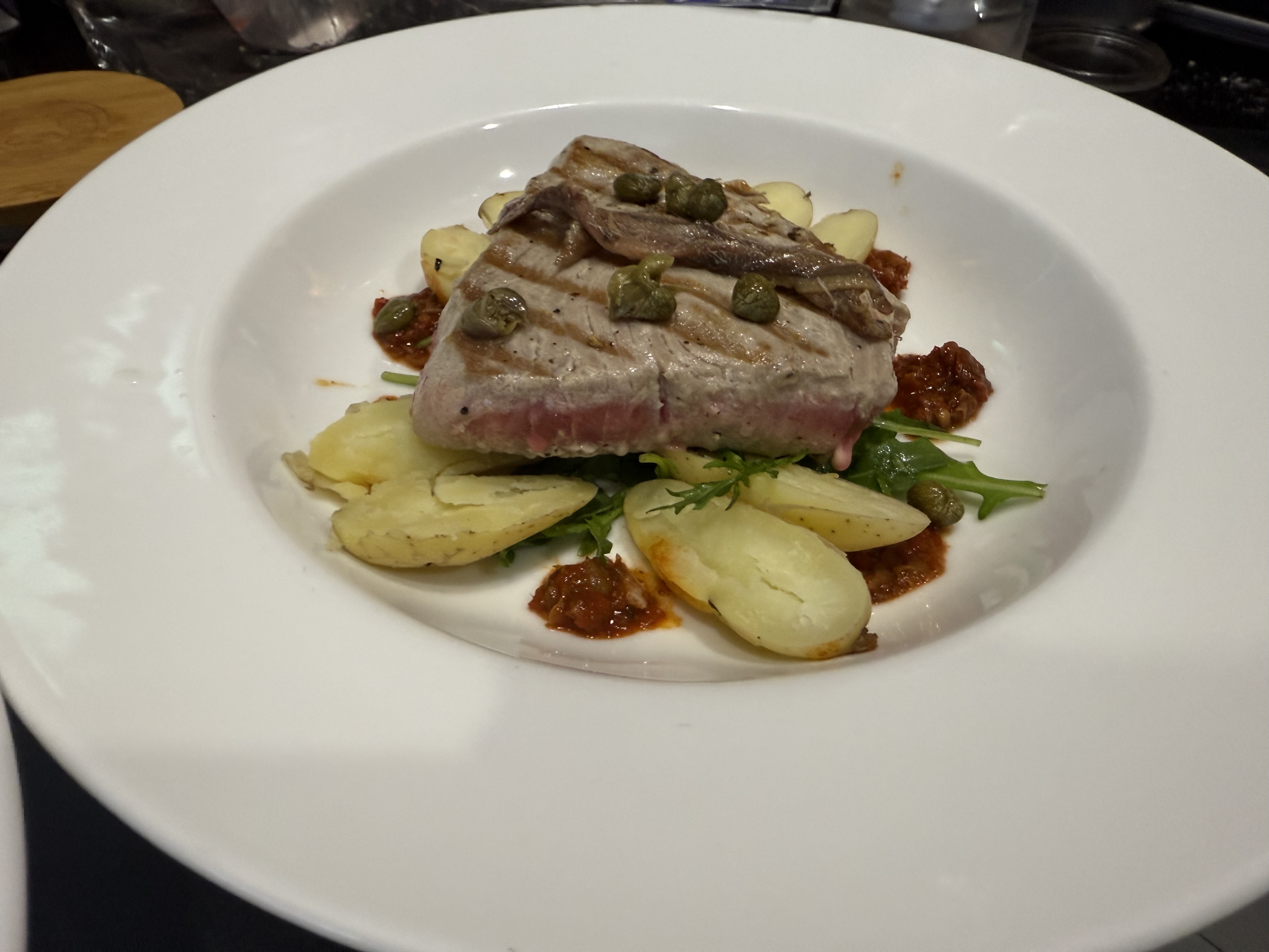 Seared tuna collar with kipfler potato, harissa and white&nbsp;anchovy