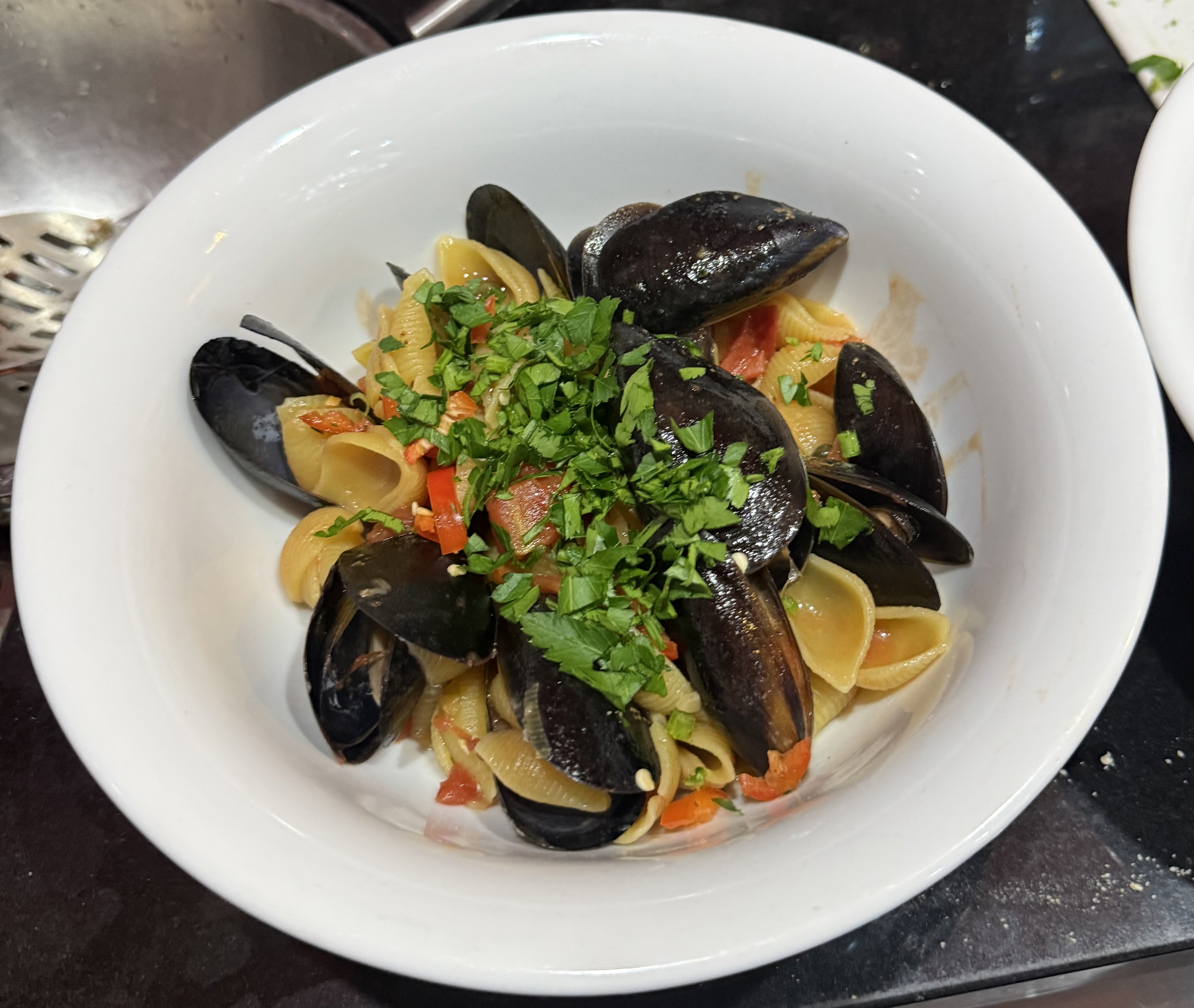 Conchiglie with mussels, baby capers and fresh tomatoes