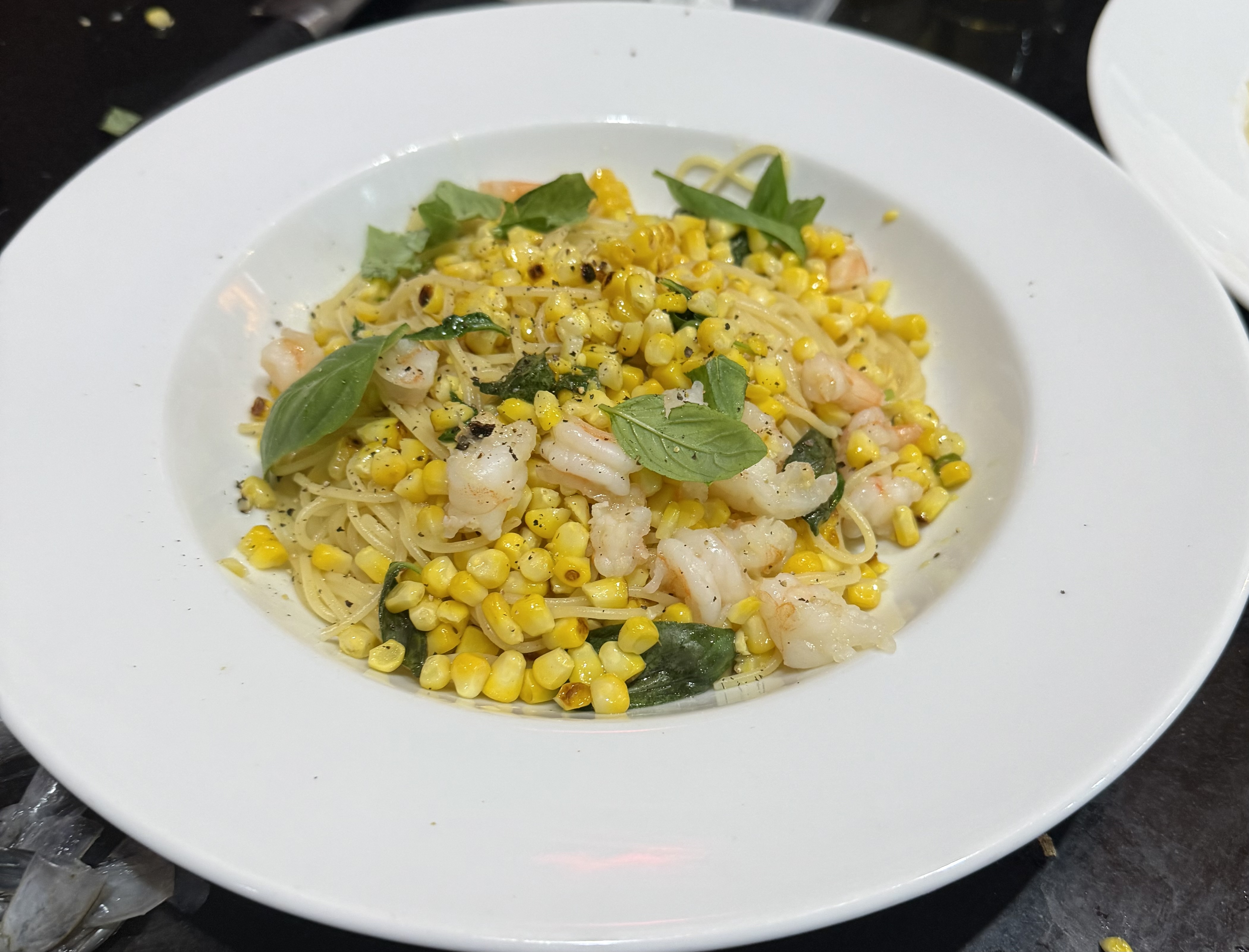 Spaghettini, prawns, charred corn, green chilli, black&nbsp;garlic