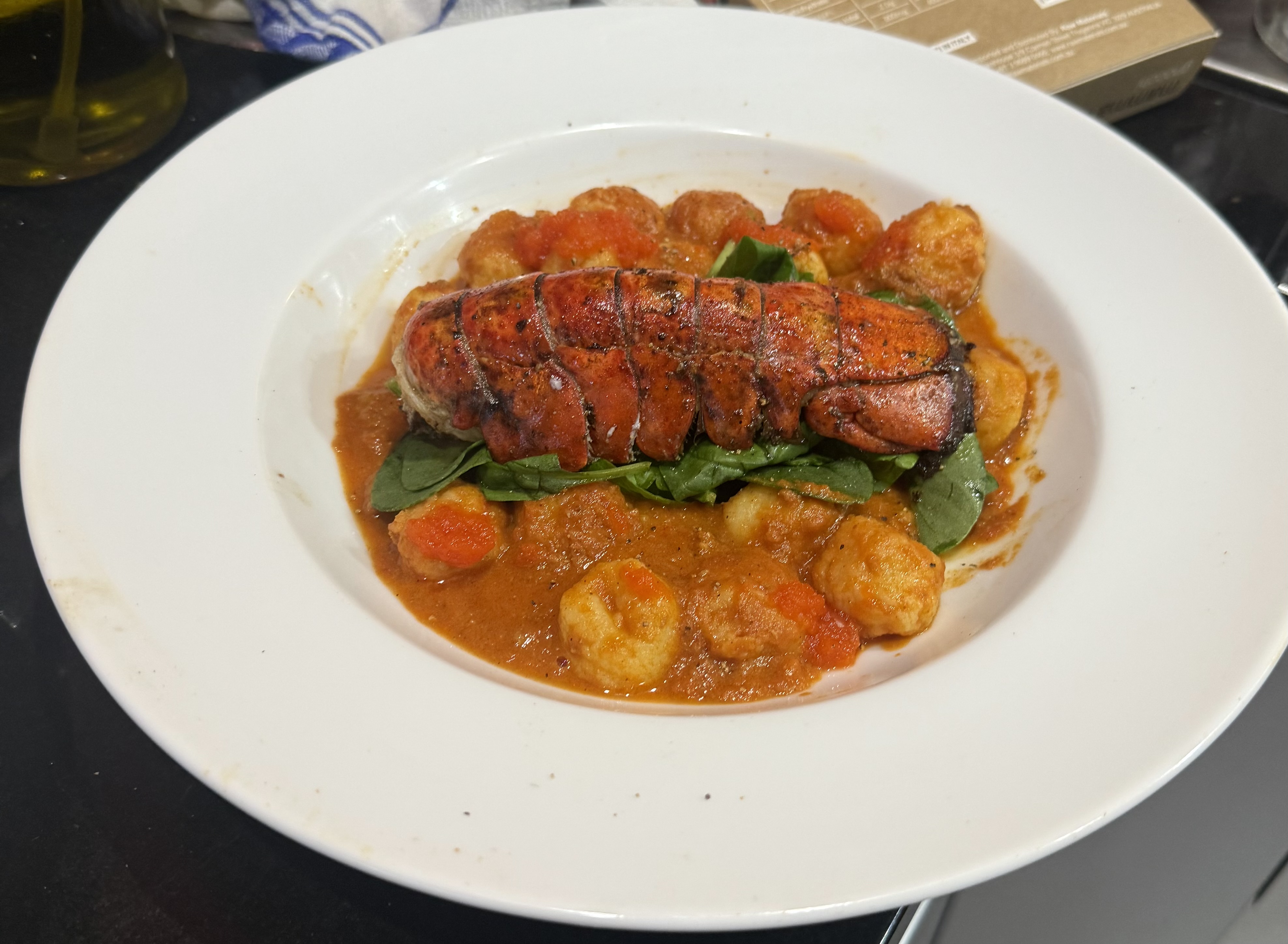 Lobster tail with Potato Gnocchi, Wilted Spinach and Nduju Alla Vodka sauce.