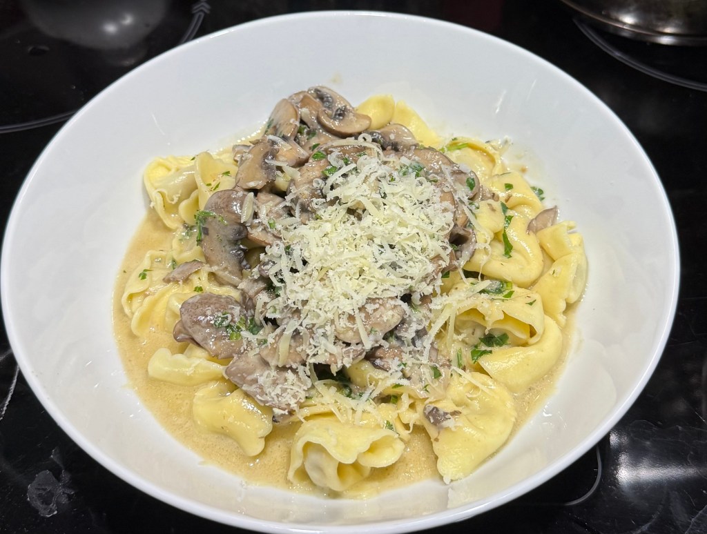 Veal tortellini with creamy mushroom sauce