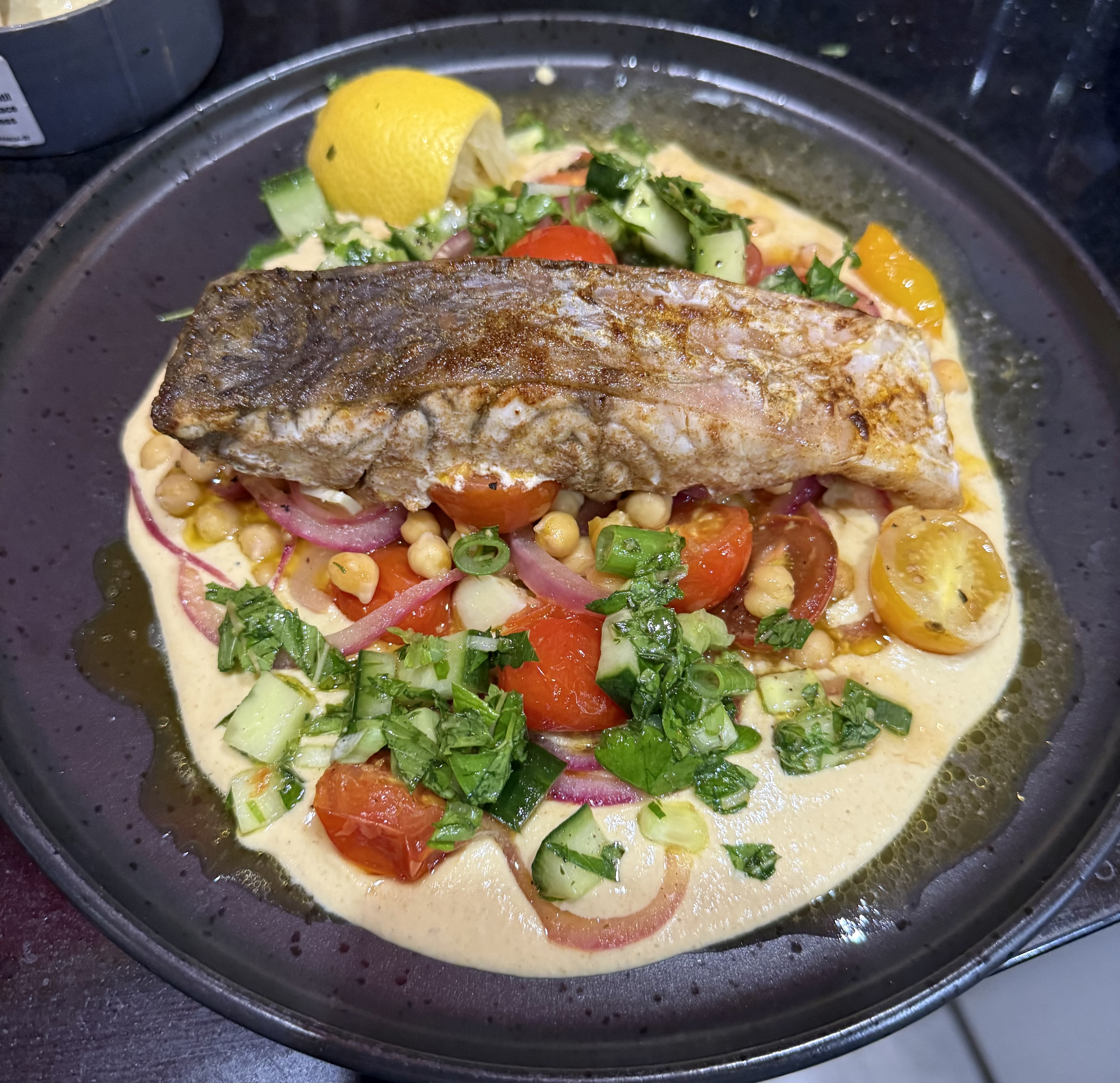 Baked Humpty Doo Barramundi with cherry tomatoes, hummus and&nbsp;tabbouli