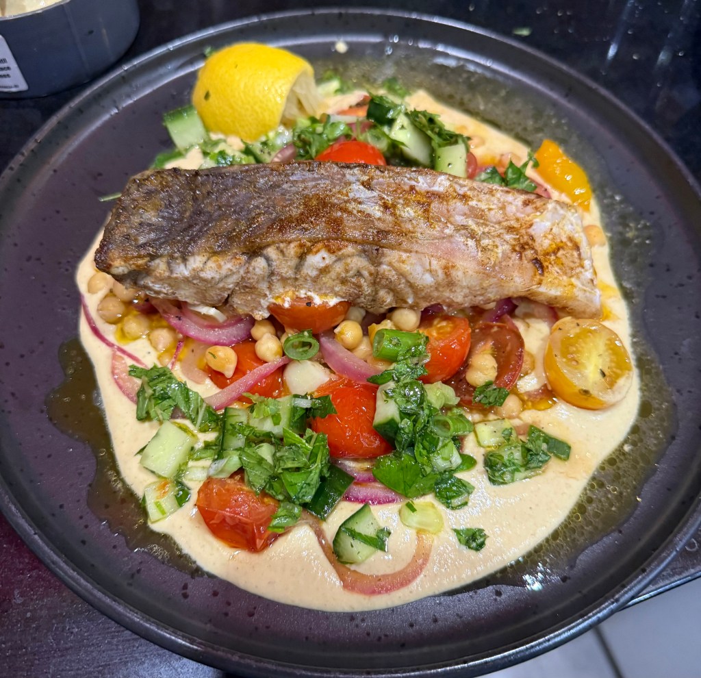 Baked Humpty Doo Barramundi with cherry tomatoes, hummus and&nbsp;tabbouli