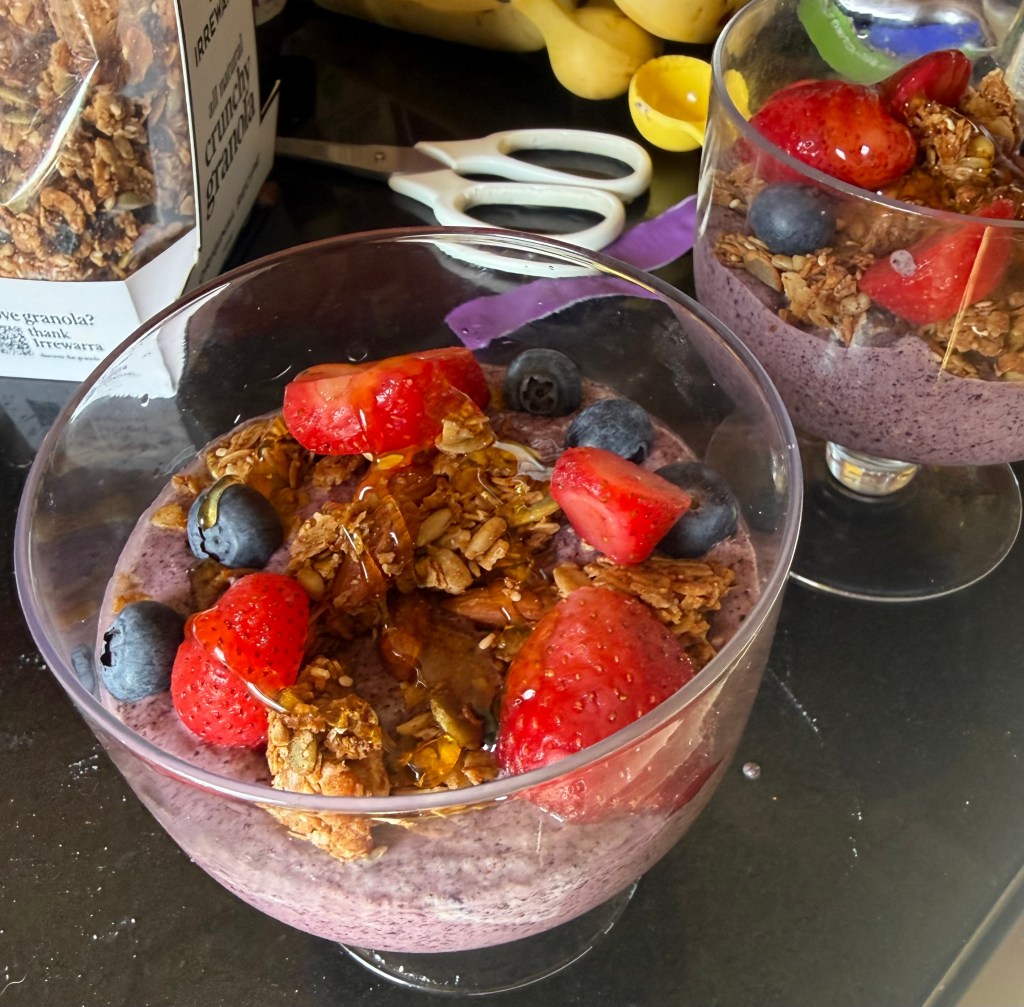 Acai bowl with berries, banana, granola and raw&nbsp;honey