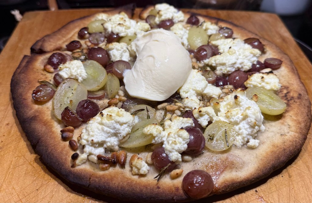 Pizza with green and red grapes, rosemary, pinenuts, and&nbsp;ricotta